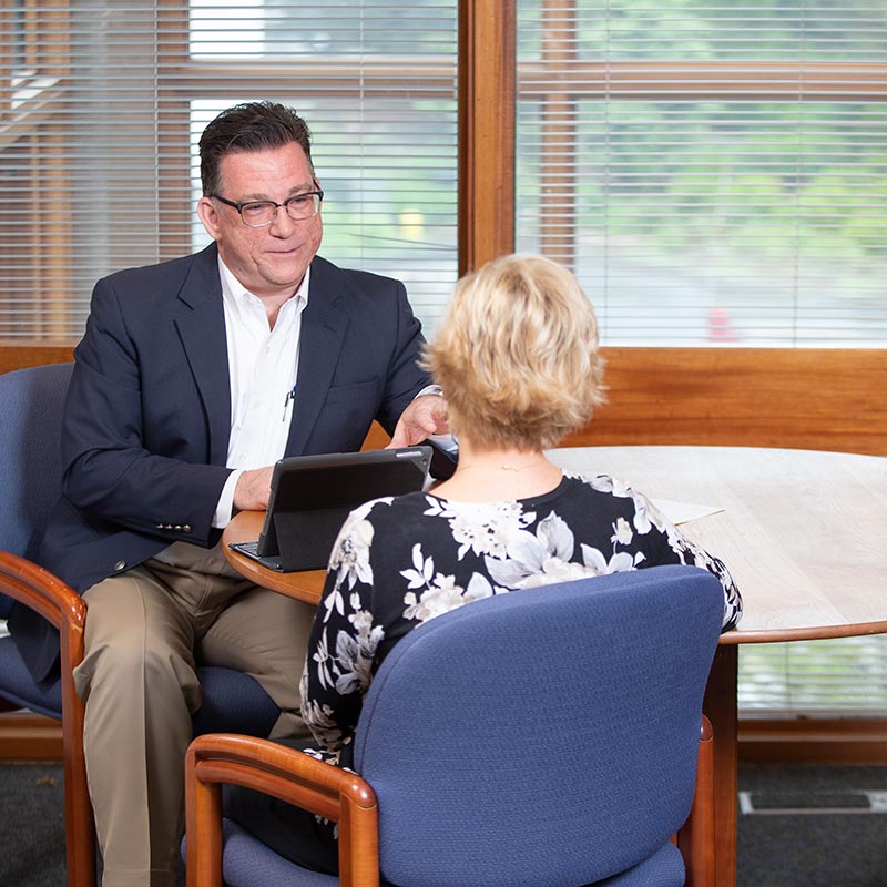 Private banker helping client understand their financial goals