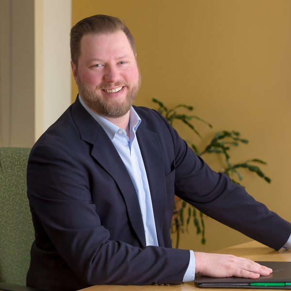 male banker smiling at the camera