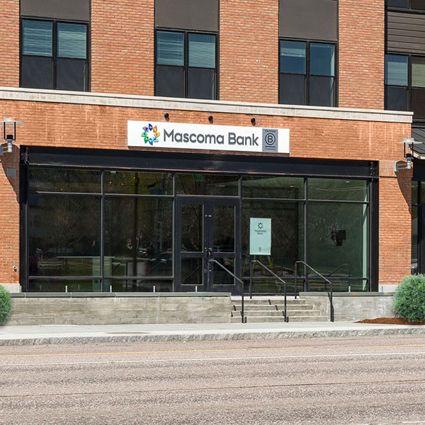 Shelburne location of a red brick building with glass doors leading into bank