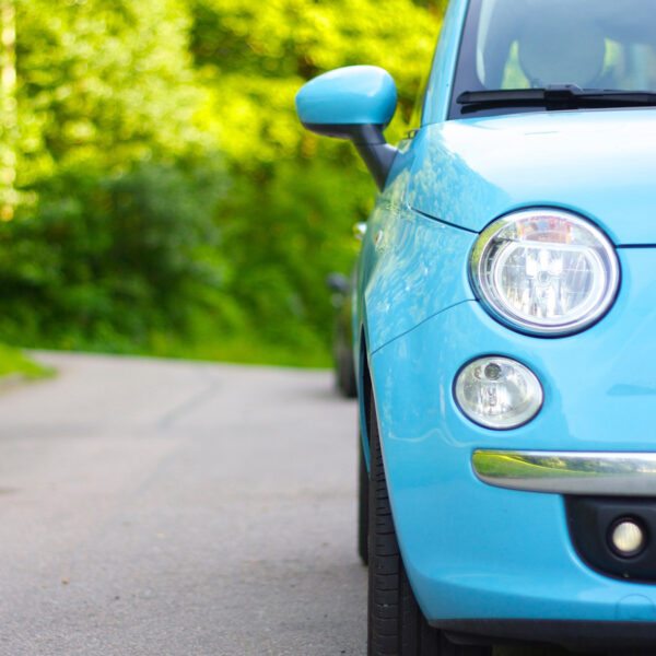 blue car on road