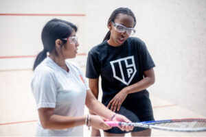 Portland Community Squash young women playing squash